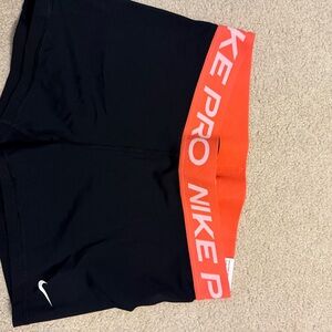 Nike Women's Athletic Shorts in Black and Orange